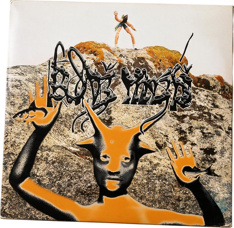 A tilted vinyl record sleeve with a goat-headed figure spray-painted in orange over a rocky landscape